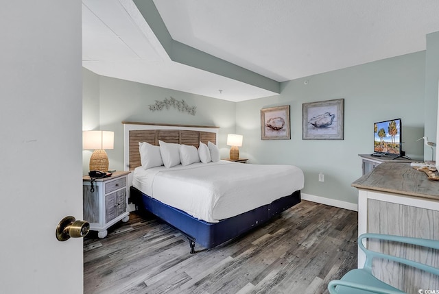 bedroom featuring dark wood-type flooring