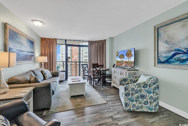 1501 S Ocean Blvd Unit 1150, Myrtle Beach, SC 29577 - living area with a wall of windows, baseboards, and wood finished floors