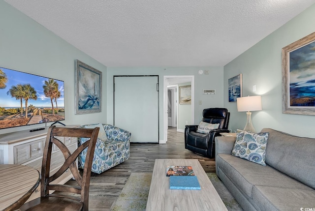1501 S Ocean Blvd Unit 1150, Myrtle Beach, SC 29577 - living room featuring a textured ceiling and wood finished floors
