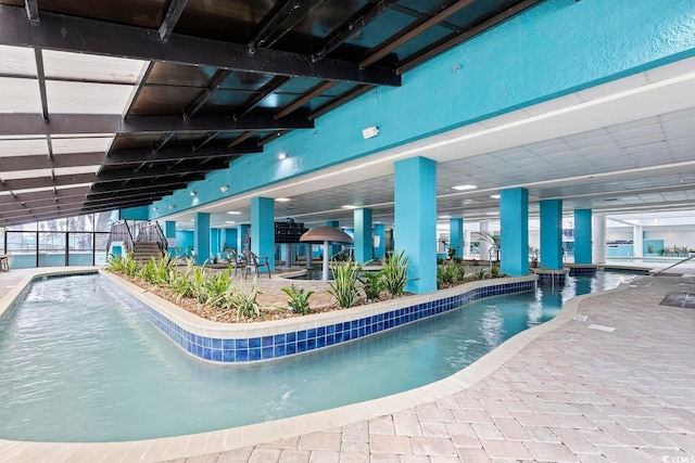 view of swimming pool featuring a patio area