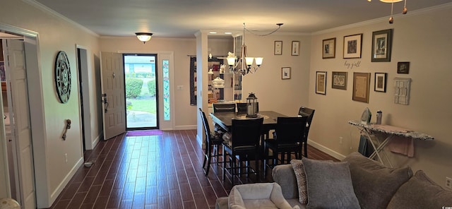 dining room with an inviting chandelier, dark hardwood / wood-style flooring, and ornamental molding