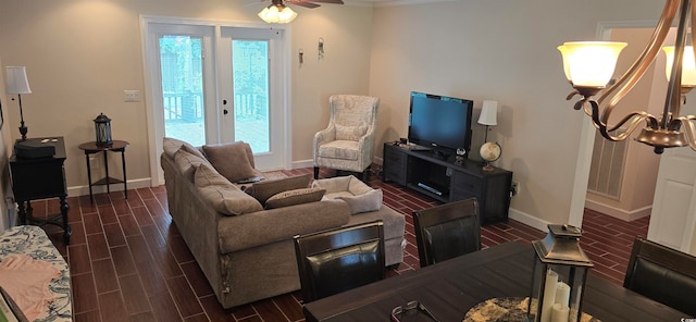 living room with dark hardwood / wood-style flooring, french doors, and ceiling fan