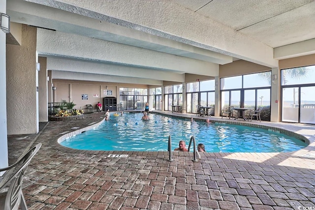 view of pool with a lanai and a patio area