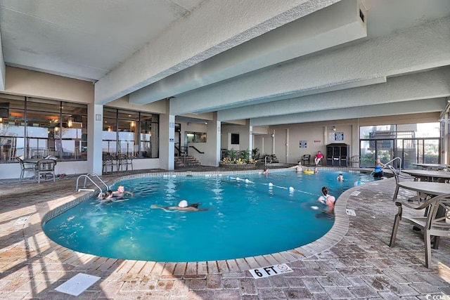 view of swimming pool with a patio area