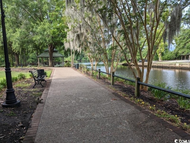 view of property's community featuring a gazebo and a water view