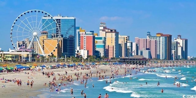 view of city featuring a view of the beach and a water view