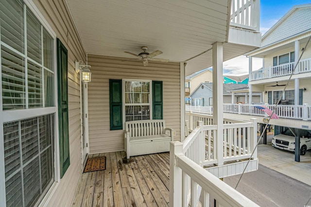 wooden terrace featuring ceiling fan