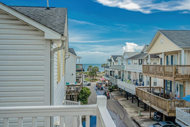 balcony featuring a water view