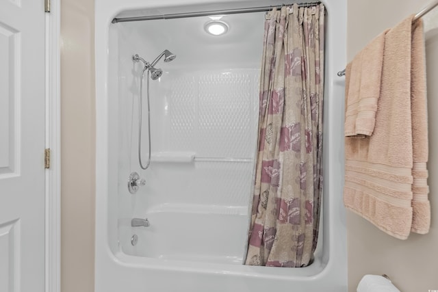 bathroom with shower / tub combo with curtain