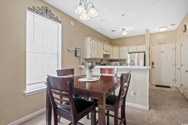 500 River Oaks Dr Unit 58I, Myrtle Beach, SC 29579 - dining room featuring a chandelier and light carpet