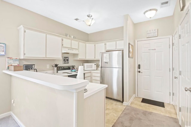 500 River Oaks Dr Unit 58I, Myrtle Beach, SC 29579 - kitchen featuring white cabinets, white appliances, and kitchen peninsula