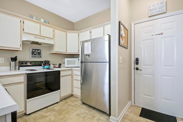 500 River Oaks Dr Unit 58I, Myrtle Beach, SC 29579 - kitchen featuring white cabinets, stainless steel refrigerator, and electric stove