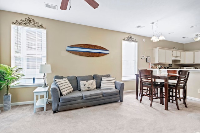 500 River Oaks Dr Unit 58I, Myrtle Beach, SC 29579 - carpeted living room featuring ceiling fan with notable chandelier