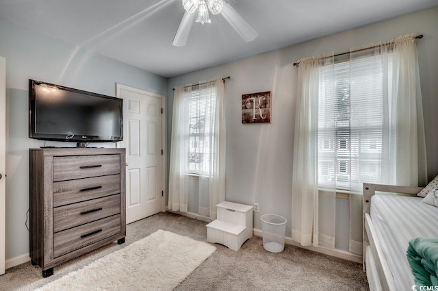 carpeted bedroom with ceiling fan