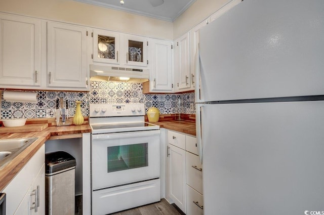 kitchen with wooden counters, ornamental molding, white appliances, decorative backsplash, and white cabinets