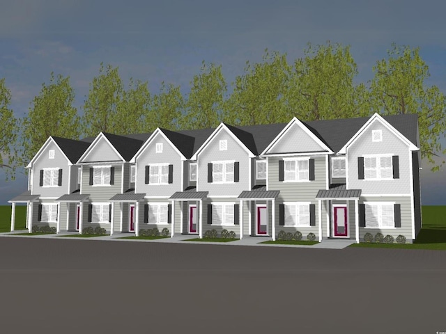 view of front of home featuring a residential view, a standing seam roof, and metal roof