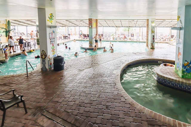 pool with an indoor hot tub