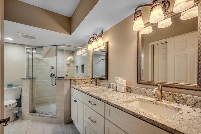 bathroom with a stall shower, visible vents, a sink, and toilet