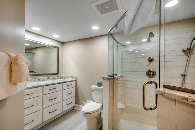 bathroom with toilet, recessed lighting, vanity, visible vents, and a stall shower