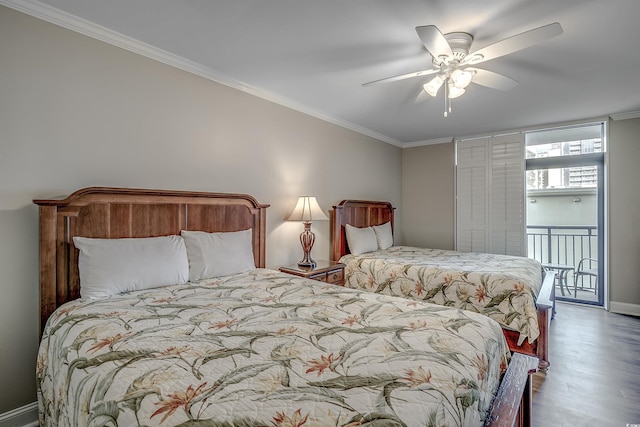 bedroom featuring baseboards, a ceiling fan, ornamental molding, wood finished floors, and access to outside