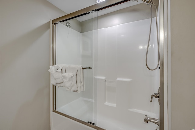 full bathroom with shower / bath combination with glass door