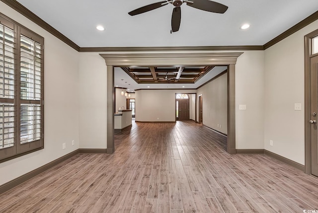 spare room featuring light hardwood / wood-style floors, ornamental molding, beam ceiling, and coffered ceiling