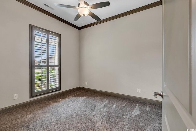 carpeted spare room featuring ceiling fan and ornamental molding