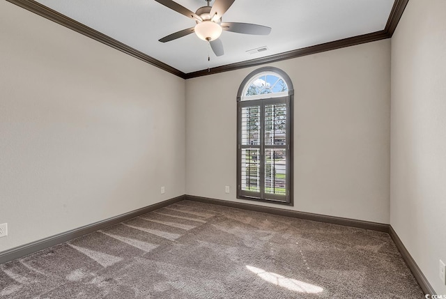 unfurnished room with ornamental molding, carpet flooring, and ceiling fan