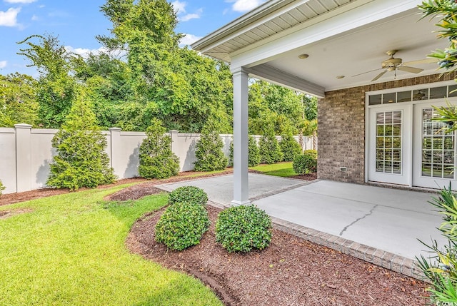 view of yard featuring a patio and ceiling fan