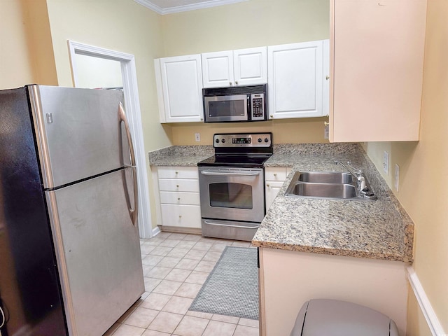 kitchen with white cabinets, stainless steel appliances, crown molding, and sink