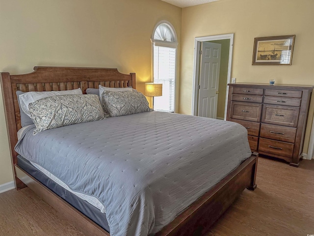 bedroom featuring hardwood / wood-style flooring