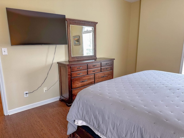 bedroom featuring dark hardwood / wood-style floors