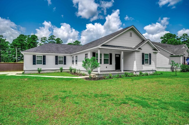 ranch-style home with a front lawn