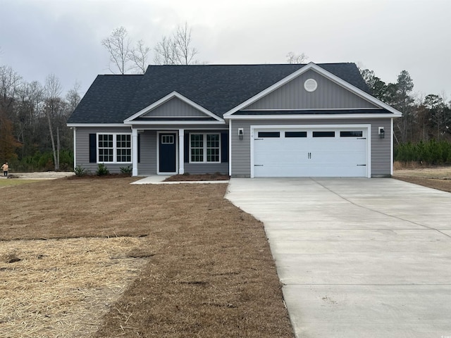 view of front of house with a garage and a front yard