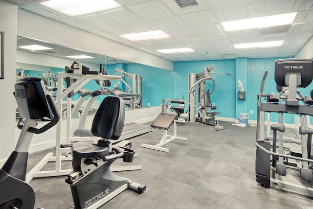 workout area with baseboards and visible vents