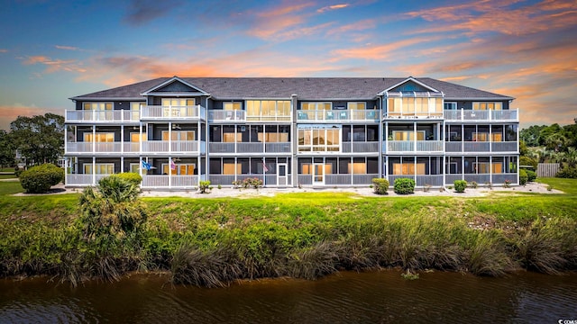 outdoor building at dusk with a water view