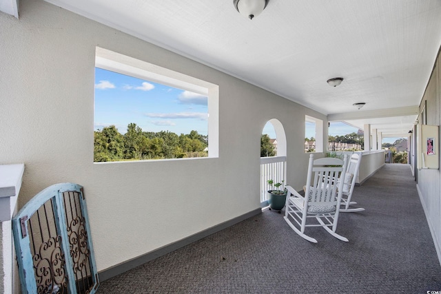 view of patio featuring a balcony