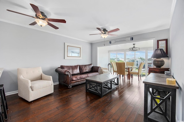 living room with crown molding, dark wood-type flooring, and ceiling fan