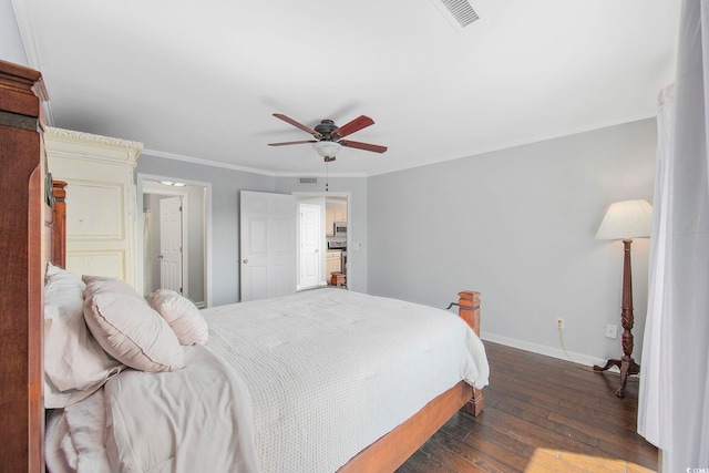 bedroom featuring dark wood-type flooring, ceiling fan, and ornamental molding