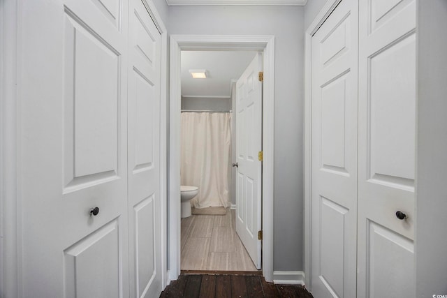 corridor with dark wood-type flooring