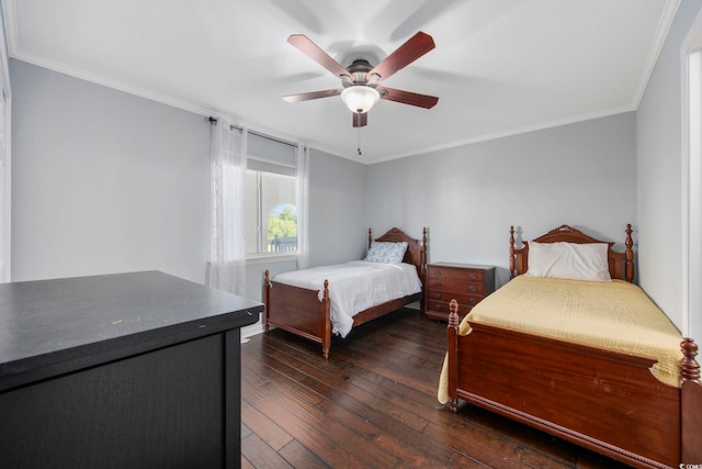 bedroom with ornamental molding, dark wood-type flooring, and ceiling fan