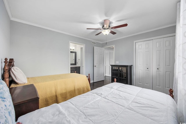 bedroom featuring ensuite bath, ceiling fan, ornamental molding, dark hardwood / wood-style flooring, and a closet