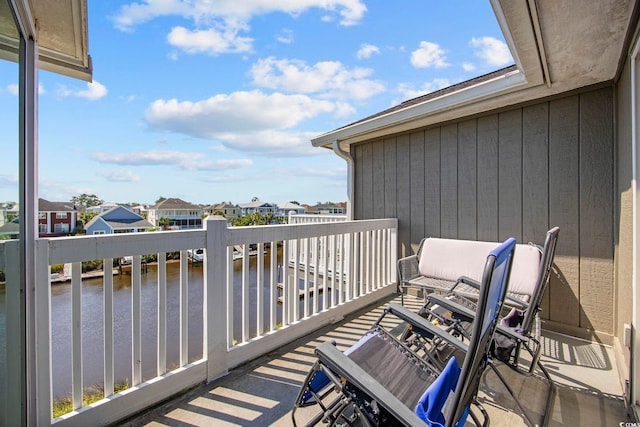 balcony featuring a water view