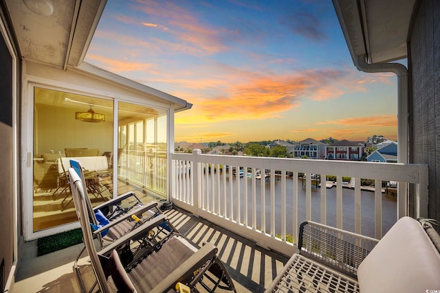 view of balcony at dusk