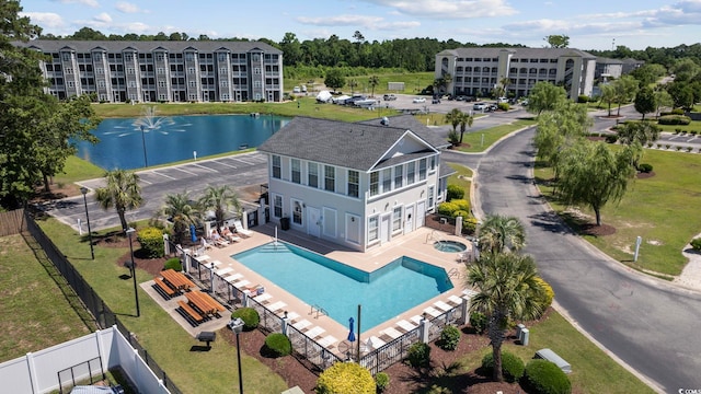 birds eye view of property featuring a water view