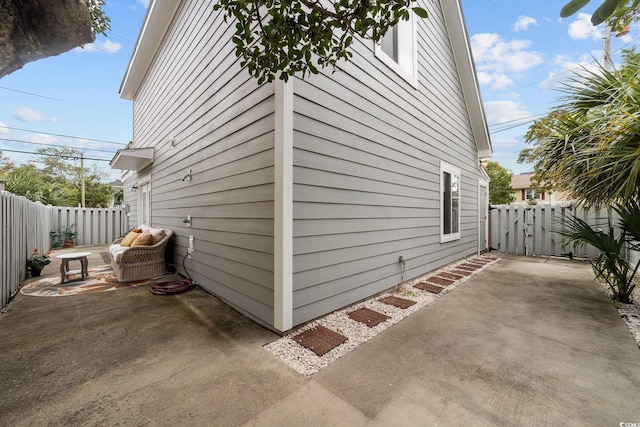 view of side of home featuring a patio