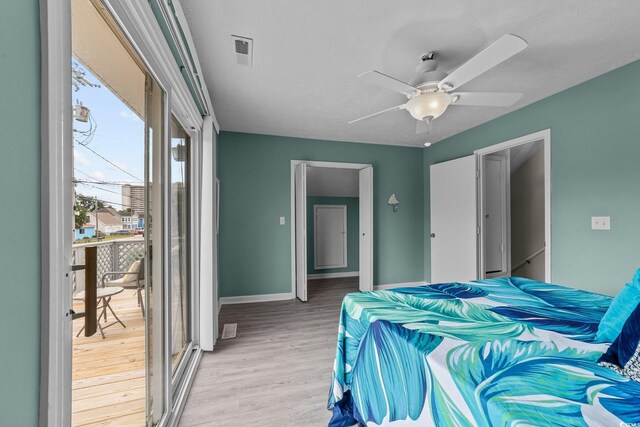 bedroom featuring a closet, light hardwood / wood-style floors, and ceiling fan