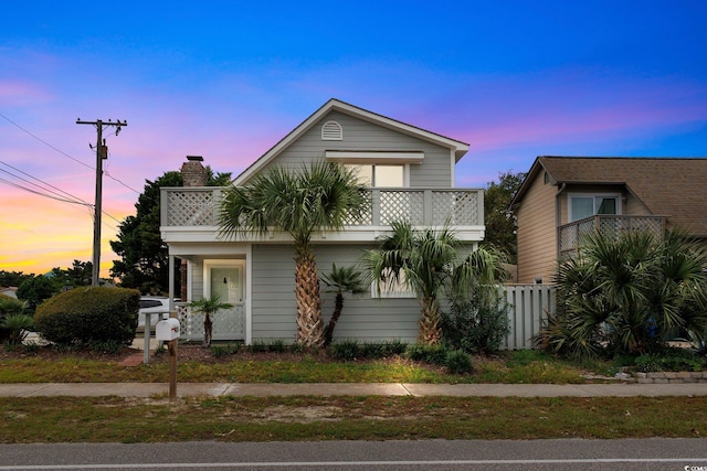 view of front of property with a balcony