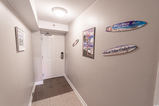 corridor with tile patterned flooring