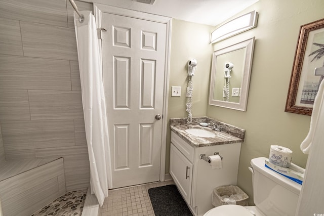 bathroom featuring vanity, toilet, and a shower with curtain